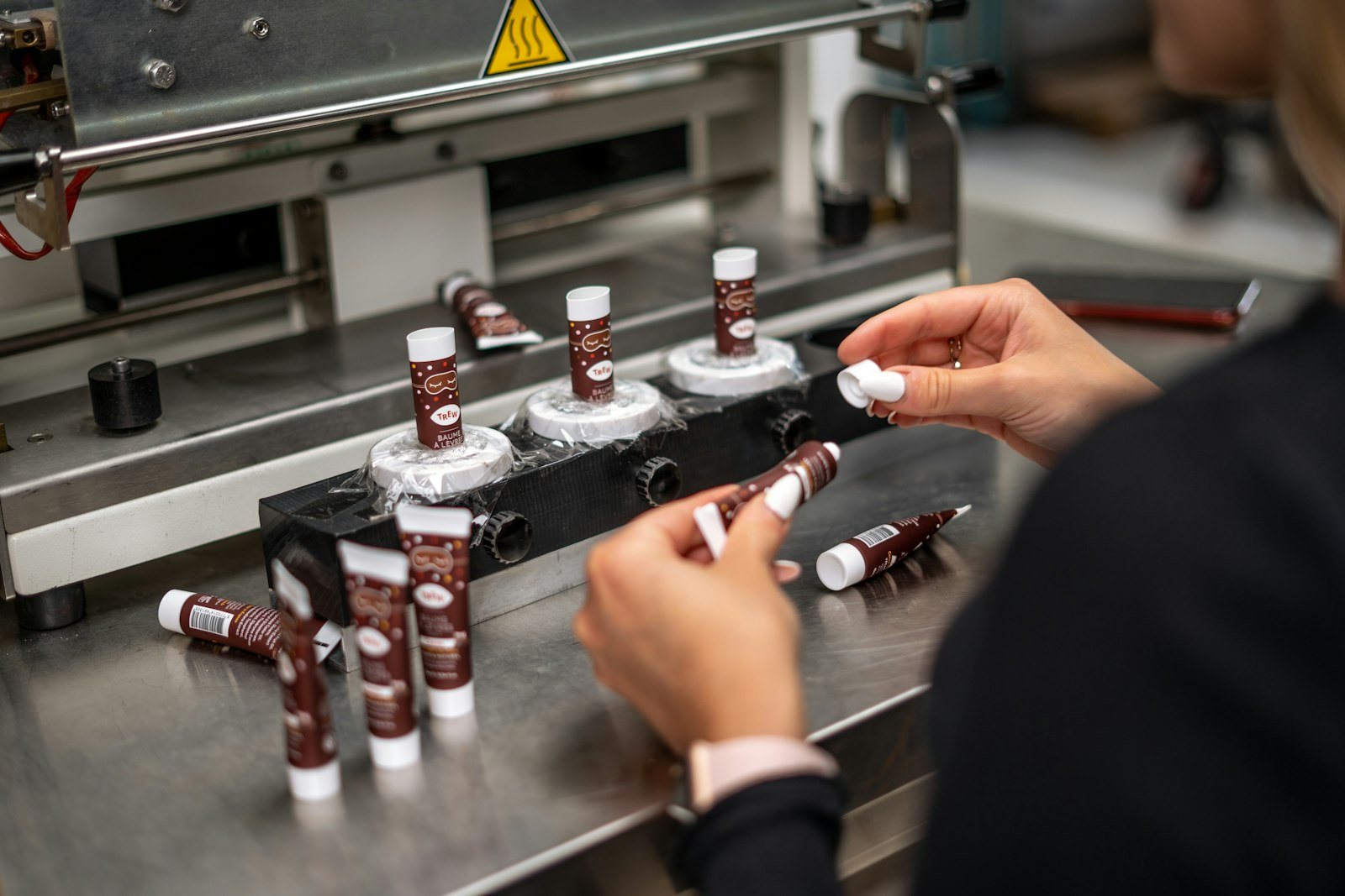 A specimen tube being labeled in a laboratory