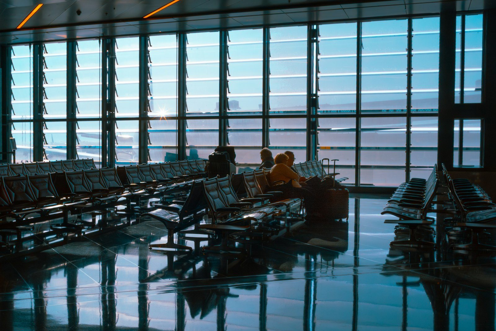 An aircraft seen from an airport terminal window