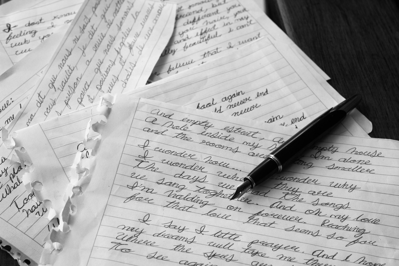 Handwritten notes and a pen on a desk