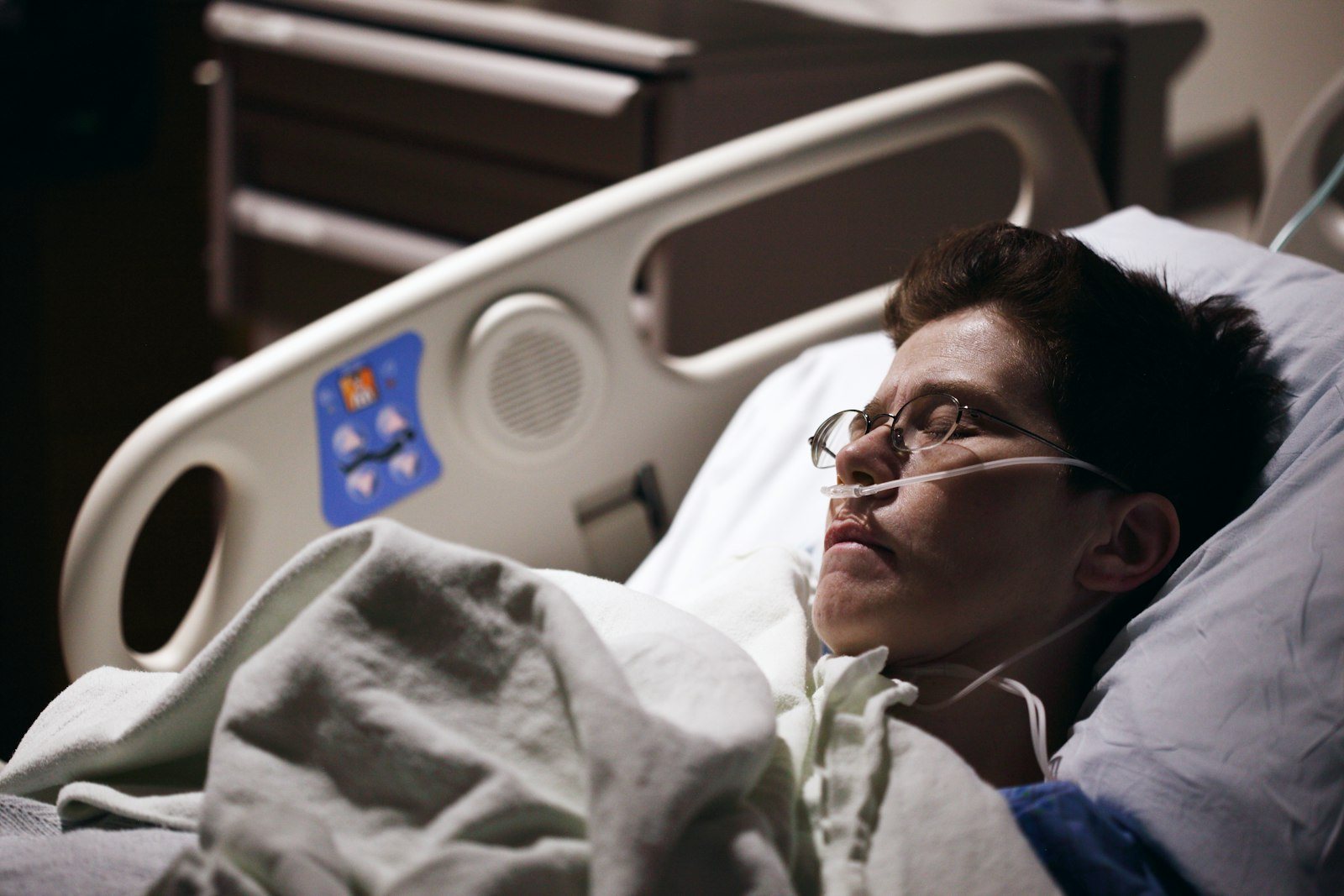 A patient sitting up in a hospital room