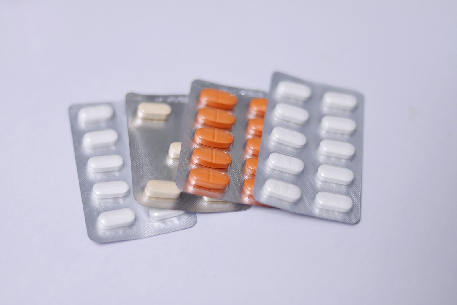 Several blister packs of tablets and capsules