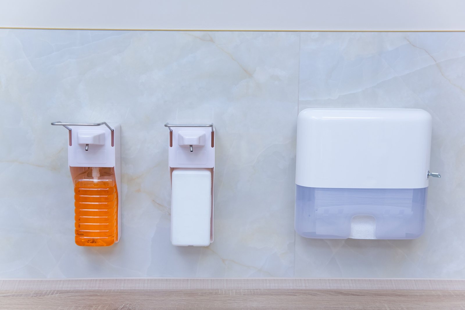 Wall-mounted soap and sanitizer dispensers