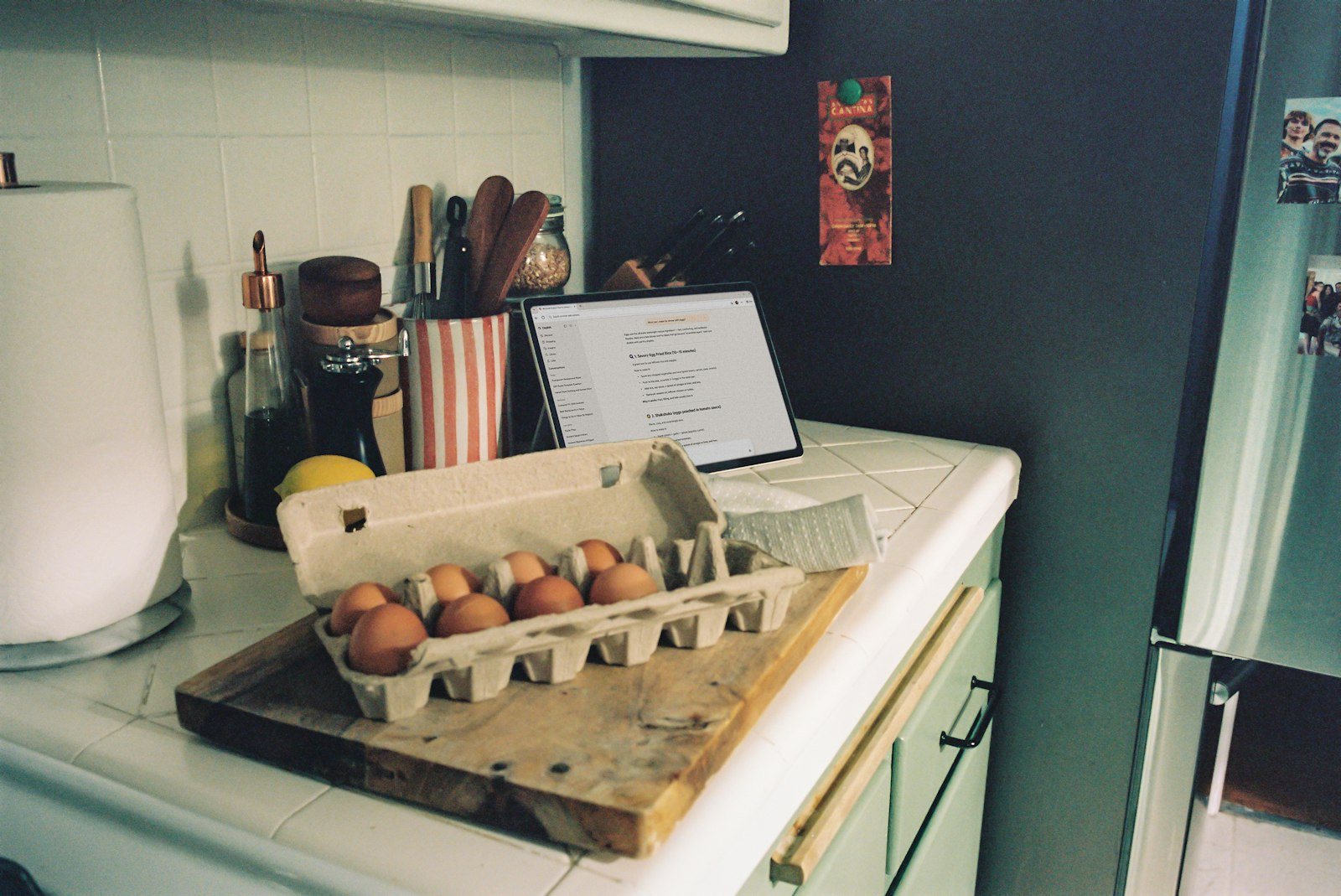 Eggs and a cutting board on a kitchen counter