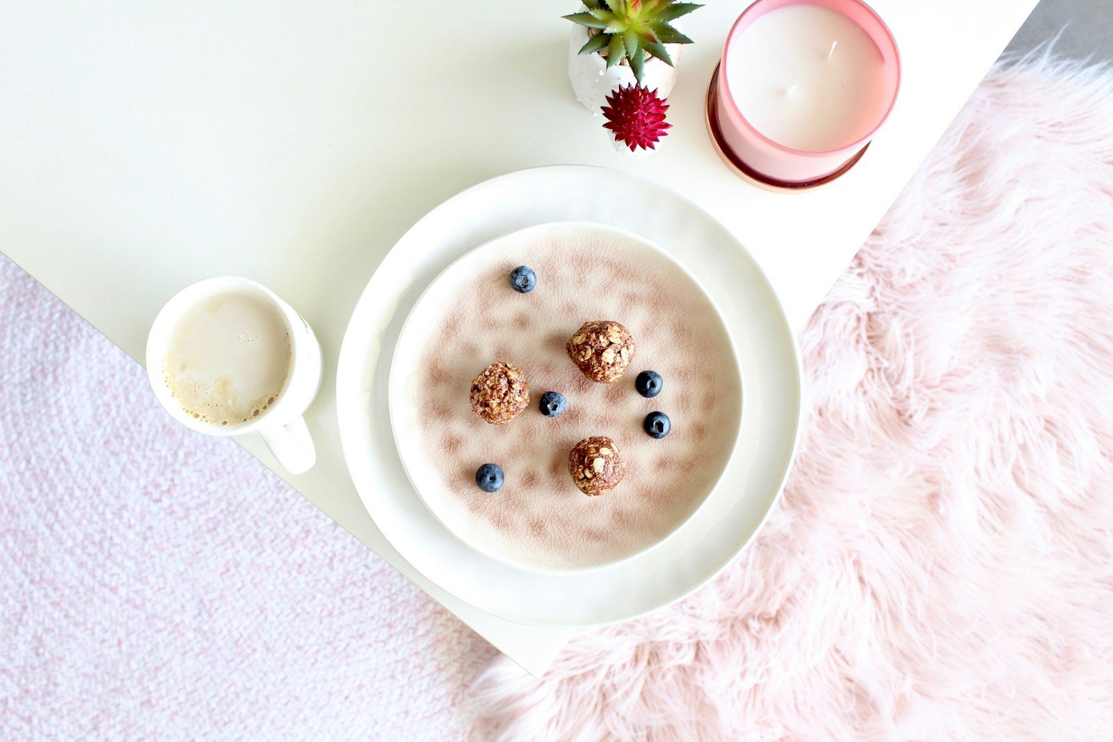A breakfast bowl of yogurt with fruit and granola