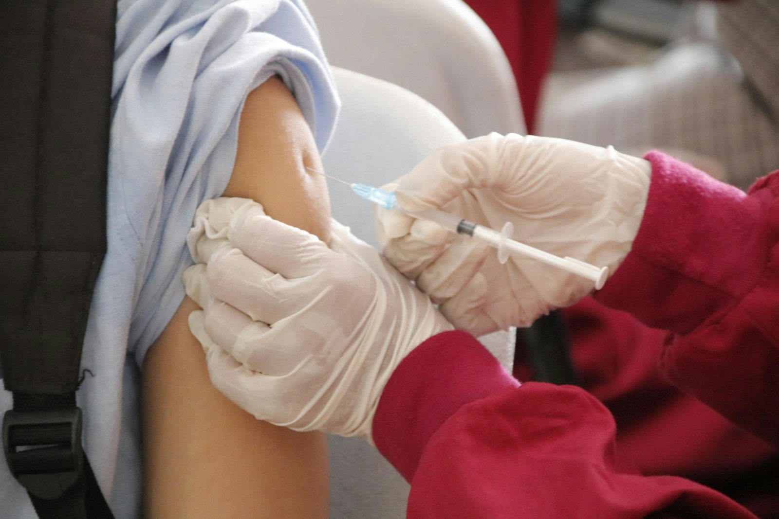 An injection being given into the upper arm