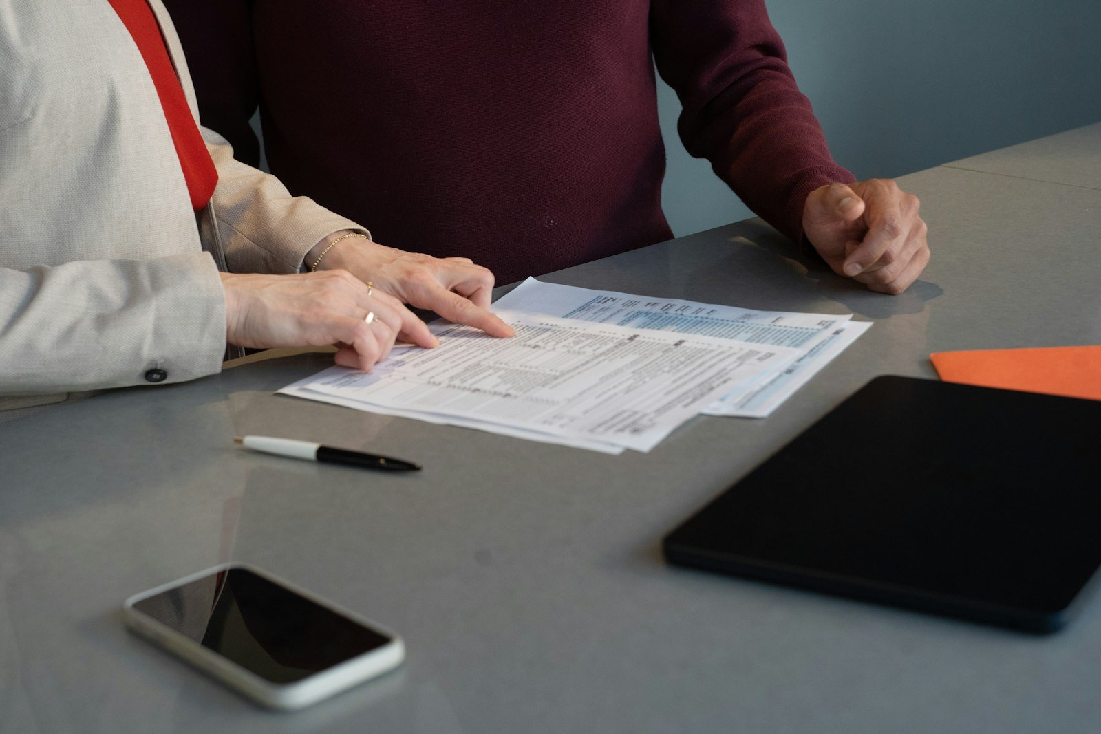 Two people reviewing a document at a table